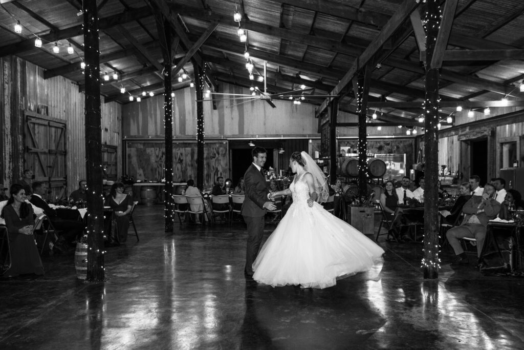 newlyweds dance at spire mountain cellars