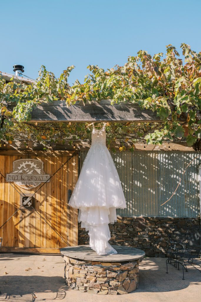 wedding dress hanging at spire mountain cellars
